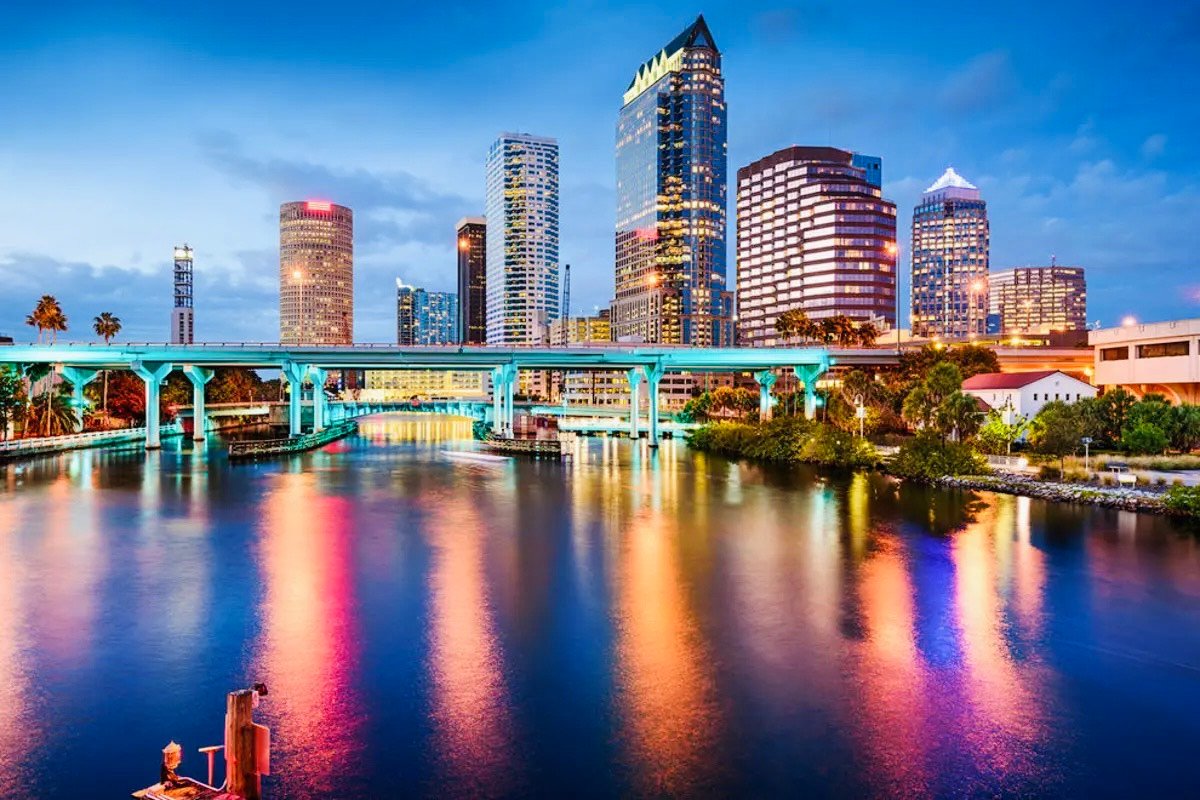 Tampa Bay skyline at sunset with waterfront and palm trees