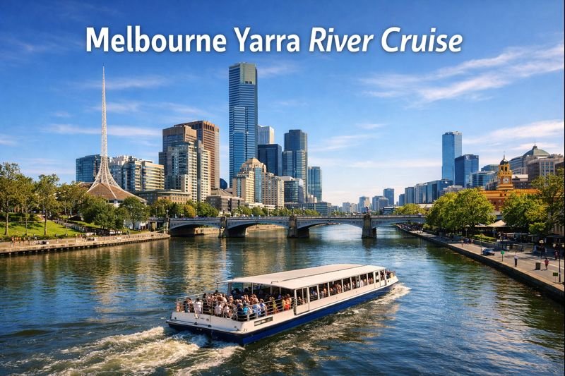 Melbourne Yarra River Cruise boat sailing past Princes Bridge with city skyline, Arts Centre spire, and modern skyscrapers on a sunny day