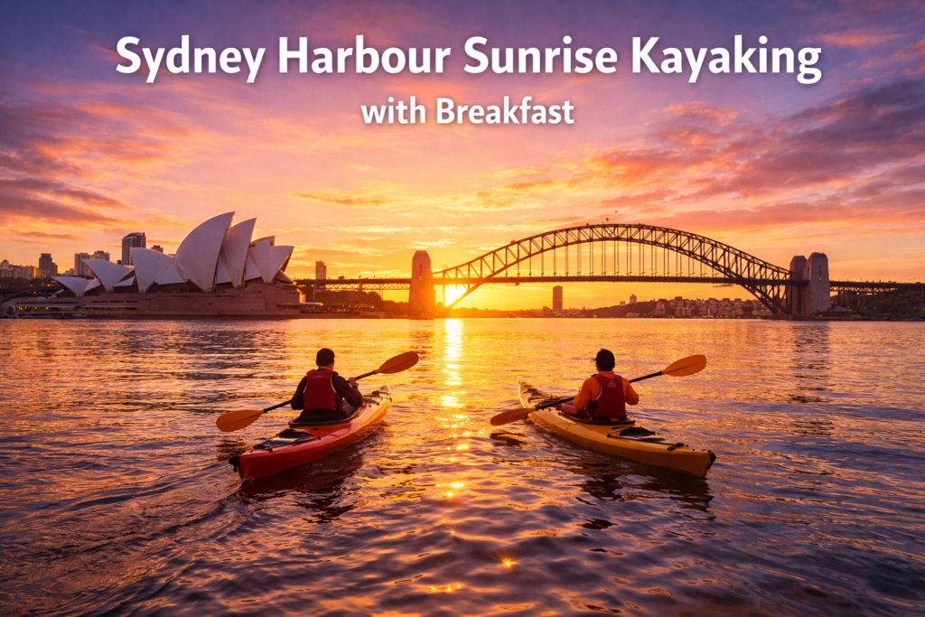 Sunrise kayaking on Sydney Harbour with kayakers paddling toward the Opera House and Harbour Bridge in golden morning light