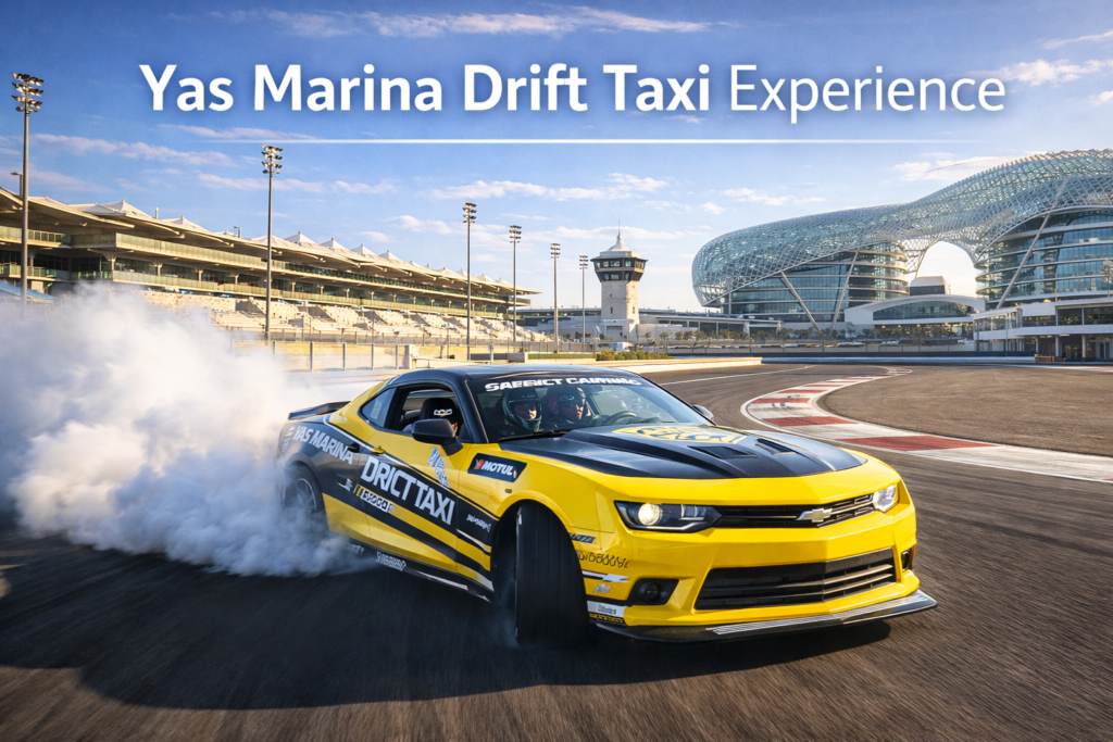 Yas Marina Drift Taxi Experience at Yas Marina Circuit showing a Chevrolet Camaro drifting with tire smoke, Formula 1 track, grandstands, and modern Abu Dhabi architecture in daylight